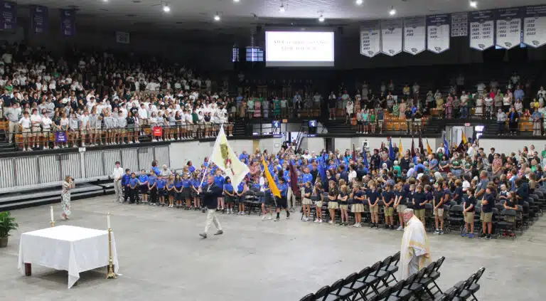 David Kessler, superintendent of schools for the Diocese of Owensboro, carries the diocesan flag to lead in representatives of all the schools. During his opening comments, Kessler thanked the Ursuline Sisters for leading so many Catholic Schools throughout the years. David Kessler, superintendent of schools for the Diocese of Owensboro, carries the diocesan flag to lead in representatives of all the schools. During his opening comments, Kessler thanked the Ursuline Sisters for leading so many Catholic Schools throughout the years.