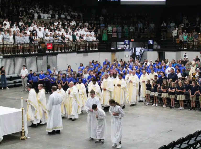 Priests of the diocese file in two by two to begin the Mass. Priests of the diocese file in two by two to begin the Mass.