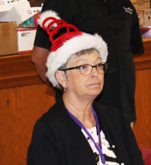 Paula Chandler Gray A’73, Alumnae Association treasurer, is always known for her interesting hat choices. Here she sports an early Christmas look.