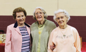 The Sherron sisters pose for a photo following the ceremony. From left are Patricia Sherron Ringswald, Joan Sherron Hofman and Rose Sherron Strickland, A’45.