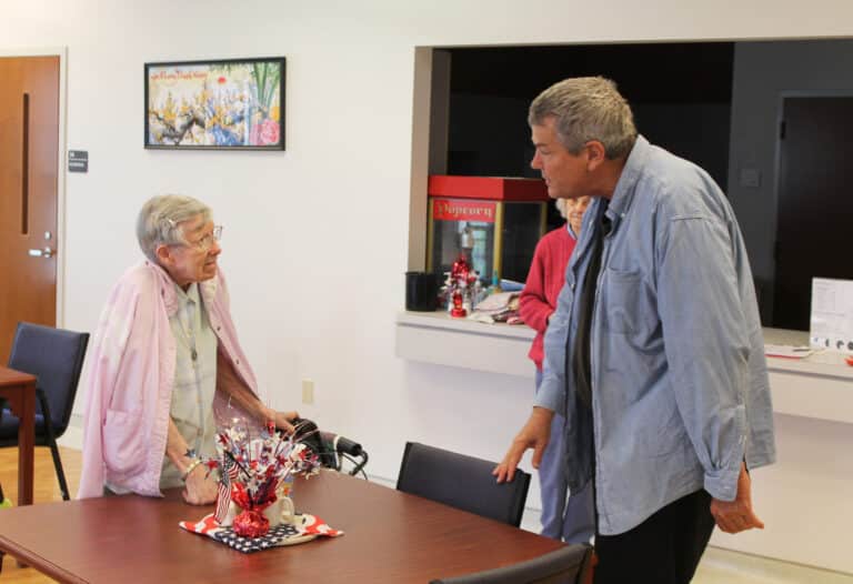 Father Ray talks with Sister Amanda Rose Mahoney after his playing. Sister Amanda Rose taught at Blessed Mother School in Owensboro in the 1960s, and Father Ray grew up across the street. Father Ray talks with Sister Amanda Rose Mahoney after his playing. Sister Amanda Rose taught at Blessed Mother School in Owensboro in the 1960s, and Father Ray grew up across the street.