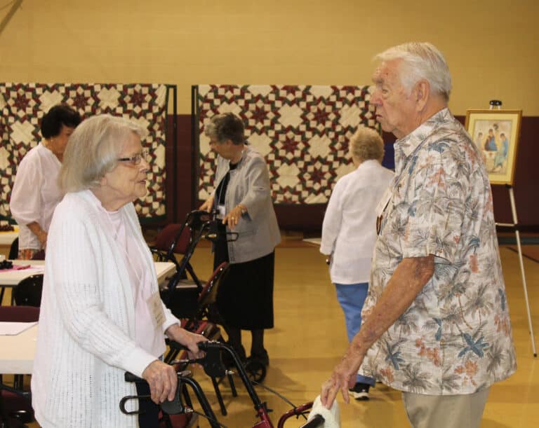 Sister Catherine Barber talks with Paducah Associate Mike Sullivan. Sister Catherine taught in Paducah from 1970-75. She is celebrating 70 years as a Sister this year.