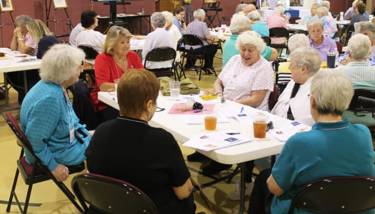 Associate Marian Bennett, center, makes a point during the reflection time, as Kansas Associate Carol O’Keefe, left, and Sister Karla Kaelin react. Also around the table from left are Sister Francis Louise Johnson, Associate Bonnie Marks and Sister Rita Scott.