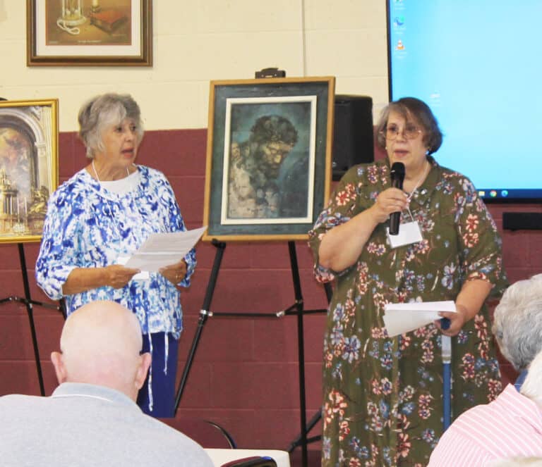 Paola, Kan., Associate Joanne Thompson, right, reads her part of the prayer, as Mayfield, Ky., Associate Sid Mason joins in. Joanne, who serves on the Associate Advisory Board, wrote the prayer for the Associate anniversaries.