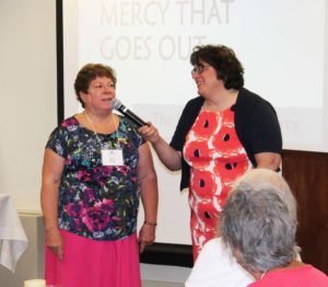Lisa M. Gulino, right, a native of Attleboro, Mass., utilizes the expertise of fellow New England native Associate Joan Perry to teach the audience how to speak “Massachusetts.”
