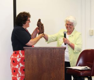 Associate Marian Bennett, right, coordinator of Ursuline Partnerships, hands Lisa M. Gulino a Saint Angela statue as a small token of appreciation.