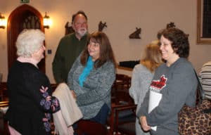 Sister Vivian Bowles, left, visits with some former students after the concert.