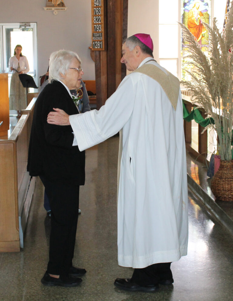 Sister Angela Fitzpatrick, celebrating 60 years, shares a moment with Bishop Medley. Sister Angela Fitzpatrick, celebrating 60 years, shares a moment with Bishop Medley.