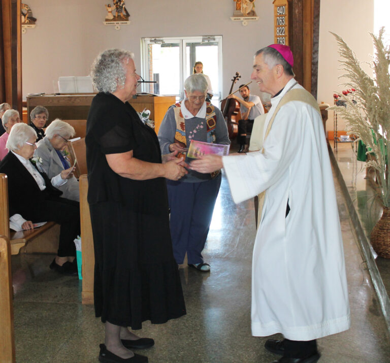 Bishop Medley greets Sister Martha Keller to celebrate her 50th jubilee. Bishop Medley greets Sister Martha Keller to celebrate her 50th jubilee.