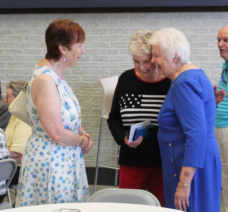 Sister Vivian Bowles, right, laughs with Sandra Midliff, left, and Elaine Grant before the ceremony began.