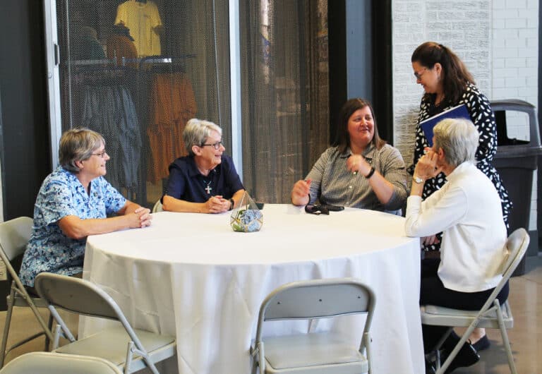 Seated from left, Ursuline Sisters Jacinta Powers, Judith Nell Riney, Monica Seaton and Maureen O’Neill talk with Susan Montalvo-Gesser, head of Catholic Charities for the Diocese of Owensboro.