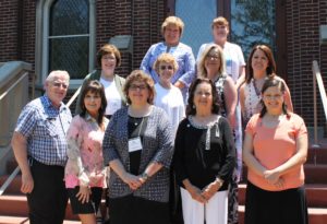 The 11 new Ursuline Associates are, from left, first row, Victor Fromm, Nanette Foley, Martha Alle, Betty Donahue and Kris Mango; second row, Lynn Fromm, Alisa Clark, Sherry Newton and Aimee McCarty; top row, Martha Warren and Doreen Abbott.
