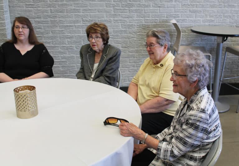 Sister Ann Patrice Cecil, right, and Sister Rose Jean Powers, second from right, are joined by Marilyn Brookman and her daughter Lucretia Hopkins. Brookman was director of Western Kentucky University’s Owensboro campus during Sister Vivian’s tenure as president of Brescia.