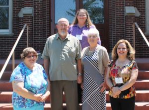 Associates who previously made their commitment but received their final pin on June 11 are, from left, Pam Knudson, Keith Putnam, Joan Teder, Genon Putnam and Jennifer Kaminski.