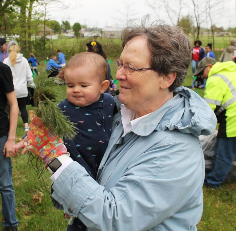 Sister Amelia helped the youngest tree planter, 7-month-old Axel, learn a little about nature.