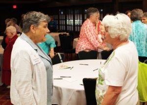 Sister Susan Mary Rathbun, left, of Cleveland talks with Ursuline Associate Marian Bennett of Mount Saint Joseph prior to the July 9 banquet.