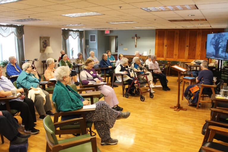 Sisters gathered in the Saint Ursula meeting room for morning and afternoon retreat sessions.