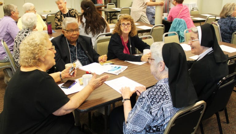 Muhlenberg County, Ky., Associates, from left, Jean Simpson, Valentino Simpao and Brenda Busick talk with Ursuline Sisters Michael Ann Monaghan, center, and Rose Karen Johnson. Sister Michael Ann is a native of Muhlenberg County, and Sister Rose Karen ministered there for 20 years.