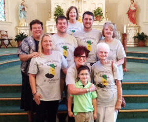 The members of the St. Jerome Parish mission group pose for a photo. In the first row, from left, is Stephanie Dodson, Rebecca Thomason and Anna Rose Buckman. The second row is Sister Martha Keller, Ben Elder, Steven Elder and Ruthie Wood. In the back row is Kay Waid. The boy in front is Baker Elder, son of Steven Elder.