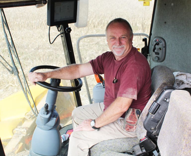 Mark Blandford drives the combine to gather corn in 2015.