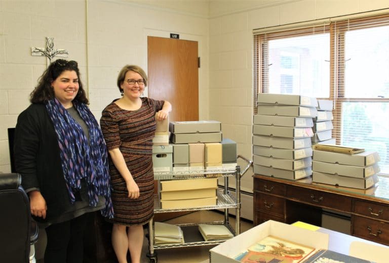 Monica Mercado from the Harvard Divinity School, left, and Heidi Taylor-Caudill, director of archives for the Ursuline Sisters of Mount Saint Joseph, stand beside many of the boxes that Heidi retrieved so that Monica could view them. Monica Mercado from the Harvard Divinity School, left, and Heidi Taylor-Caudill, director of archives for the Ursuline Sisters of Mount Saint Joseph, stand beside many of the boxes that Heidi retrieved so that Monica could view them.
