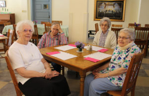 Sister Mary Agnes VonderHaar, left, enjoys the celebration. She recently retired to the Motherhouse after serving in outreach ministry in McQuady and Axtel, Ky., since 2008. Sitting with her, left to right, were Sister Grace Swift, Sister Mary Gerald Payne, and Sister Mary Angela Matthews.