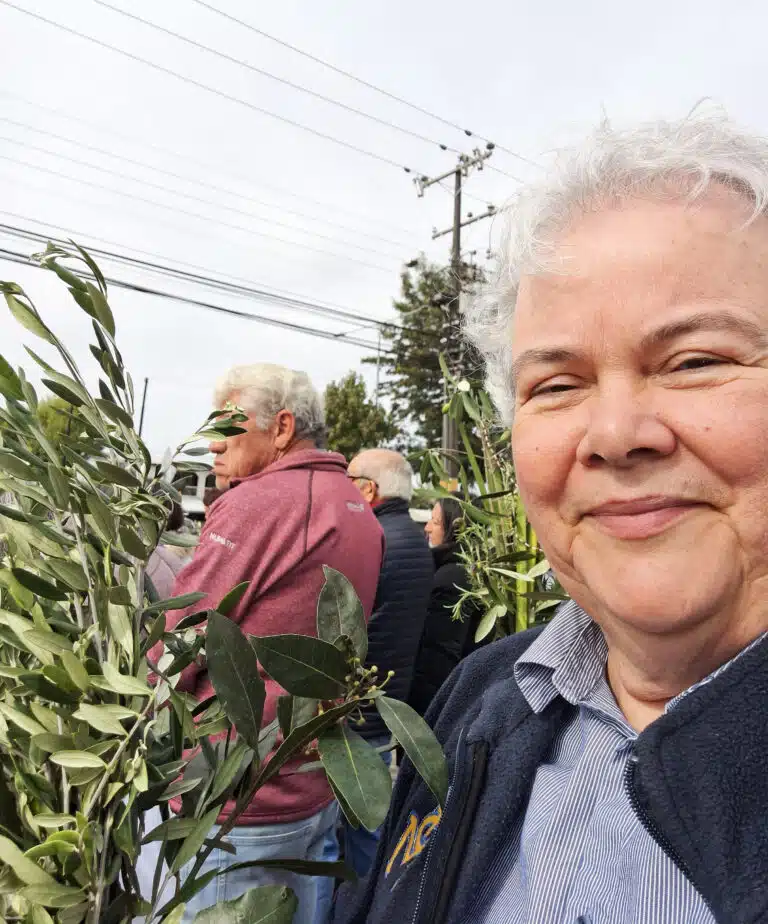 Sister Martha Keller holds her olive branch as part of the Palm Sunday procession. Sister Martha Keller holds her olive branch as part of the Palm Sunday procession.