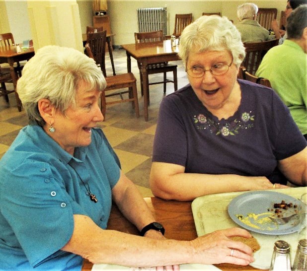 Sister Pam Mueller, left, and Sister Pat Lynch seem surprised by the paparazzi over breakfast.