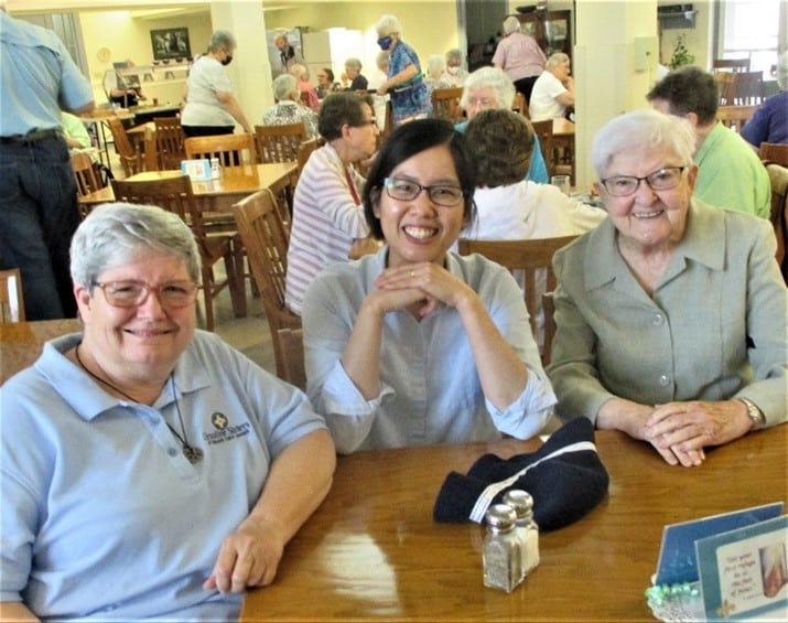 Sister Mary McDermott, left, and Sister George Mary Hagan, right, are joined by Sister Maria Bich Nyugen, who is visiting the Mount this summer.