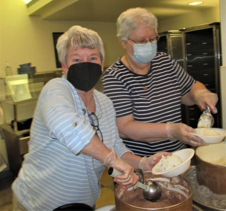 The Leadership Council is always responsible for serving ice cream on the opening night of Community Days. After six years, Sister Pam Mueller, left, and Sister Pat Lynch have earned the nicknames “Scoop.”
