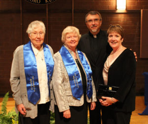 Sister Vivian, second from left, is joined by previous honoree Sister Ruth Gehres, left, whom she succeeded as president of Brescia, current Brescia President Father Larry Hostetter and Sally Halbig, the president’s assistant.