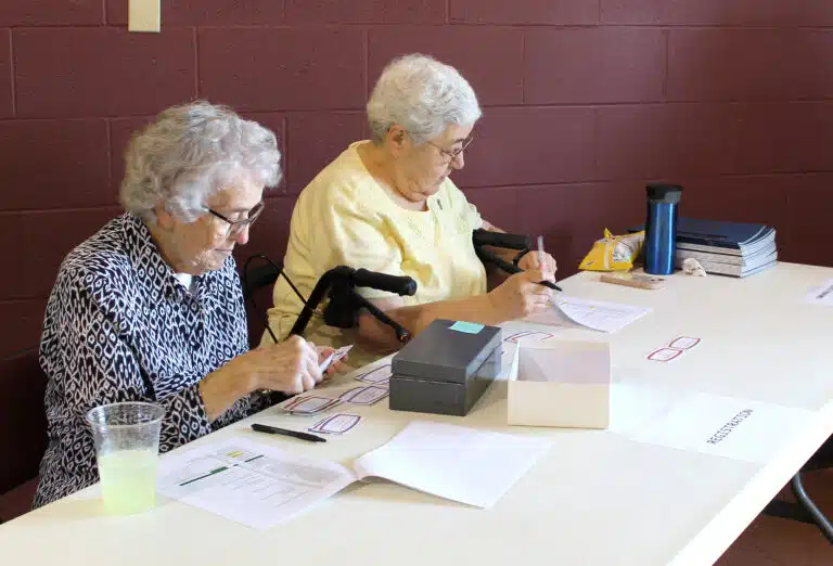 Sister Ann Patrice Cecil, left, and Sister Ann McGrew checked people in at the east side doors. Sister Ann Patrice Cecil, left, and Sister Ann McGrew checked people in at the east side doors.
