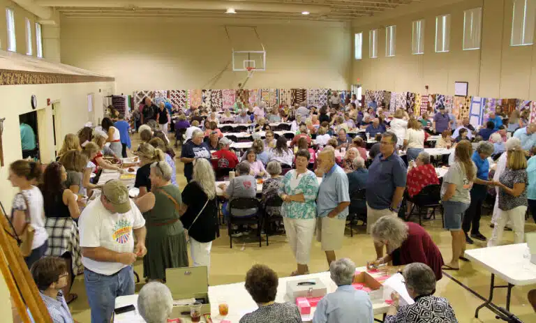 The crowd gathers early on as participants get their lunch, their seats, and their raffle tickets. The crowd gathers early on as participants get their lunch, their seats, and their raffle tickets.