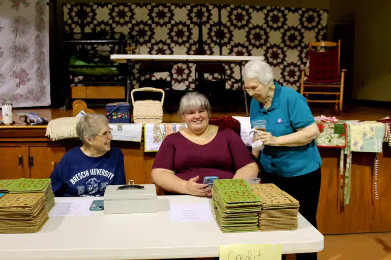 Sister Betsy Moyer, left, and Sister Pat Lynch, right, speak to Amanda Riney, Mount Saint Joseph accountant, just before the doors open and she starts selling bingo cards. Sister Betsy Moyer, left, and Sister Pat Lynch, right, speak to Amanda Riney, Mount Saint Joseph accountant, just before the doors open and she starts selling bingo cards.