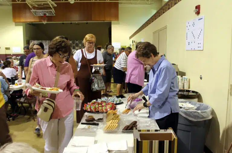 Sister Mary Henning, right, serves cookies to Pat Stelmach, left, who did the bingo calling that day. Stelmach graduated from Mount Saint Joseph Academy. Sister Mary Henning, right, serves cookies to Pat Stelmach, left, who did the bingo calling that day. Stelmach graduated from Mount Saint Joseph Academy.
