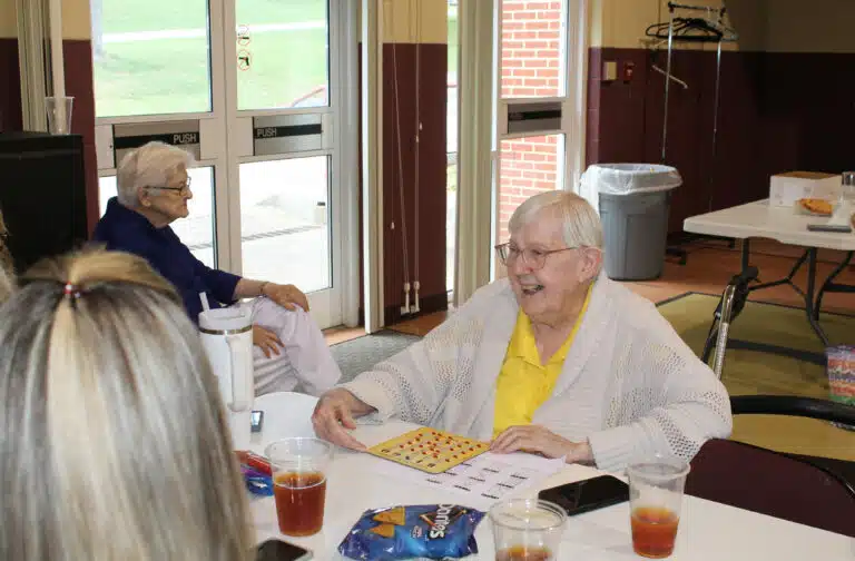 Sister Grace Simpson smiles as she plays quilt bingo. She wanted to win a quilt for her sister. She didn’t win, but she purchased a quilt to give her as a gift after the games were over. Sister Grace Simpson smiles as she plays quilt bingo. She wanted to win a quilt for her sister. She didn’t win, but she purchased a quilt to give her as a gift after the games were over.