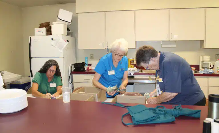 Jennifer Stone, left, director of Finance for the Ursuline Sisters, is assisted by Sister Barbara Jean Head, center, and Sister Sharon Sullivan. They were keeping track of proceeds for the half pot, raffle, and quilt sales. Jennifer Stone, left, director of Finance for the Ursuline Sisters, is assisted by Sister Barbara Jean Head, center, and Sister Sharon Sullivan. They were keeping track of proceeds for the half pot, raffle, and quilt sales.