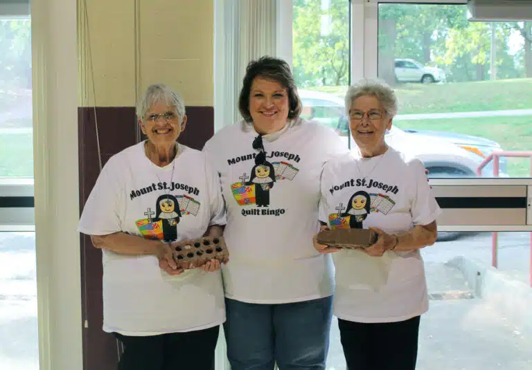Mary Jane Tungate, center, got to see Sister Mary Celine Weidenbenner, left, and Sister Nancy Murphy, her former teachers from Calvary School in Marion County, Ky. Mary Jane’s sister, Cindy Sandusky Clark, gave the two Sisters bricks from Calvary School, which was razed last year. A new school has since been built on the same site. Mary Jane Tungate, center, got to see Sister Mary Celine Weidenbenner, left, and Sister Nancy Murphy, her former teachers from Calvary School in Marion County, Ky. Mary Jane’s sister, Cindy Sandusky Clark, gave the two Sisters bricks from Calvary School, which was razed last year. A new school has since been built on the same site.