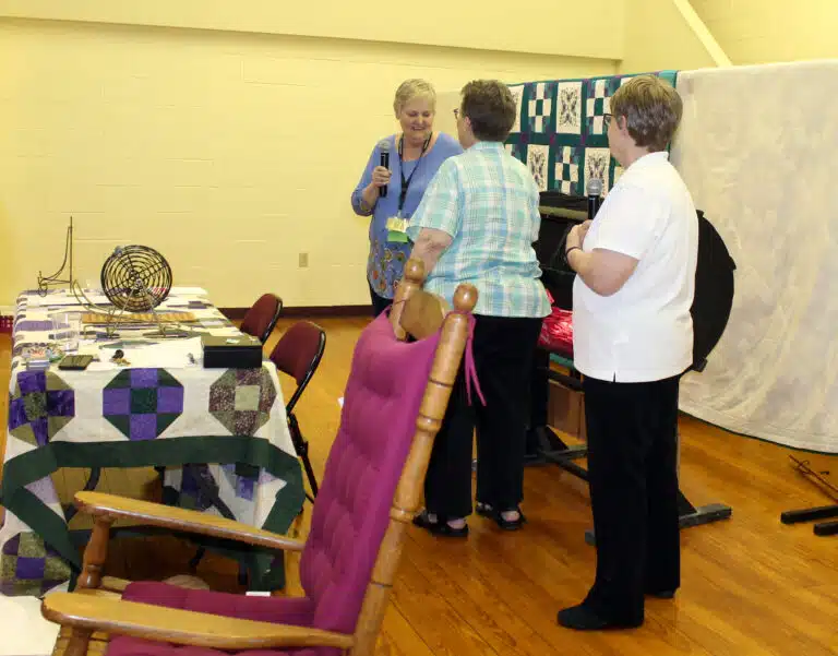 Carol Braden-Clarke, director of development, left, and Sister Amelia Stenger, right, watch as Sister Sharon Sullivan pulls the winning raffle tickets from the bin. Three cash prizes were given away as well as a beautiful, embroidered butterfly quilt. Carol Braden-Clarke, director of development, left, and Sister Amelia Stenger, right, watch as Sister Sharon Sullivan pulls the winning raffle tickets from the bin. Three cash prizes were given away as well as a beautiful, embroidered butterfly quilt.
