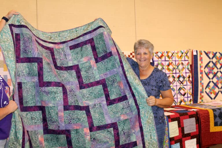 Wynnetta Carpenter of Owensboro was one of three lucky winners in the same round of bingo. They each picked out a small/medium quilt, and she chose “In the Garden.”