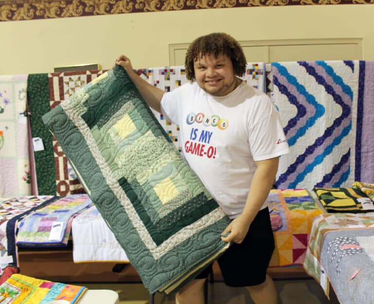 Lance Price of Owensboro, who was ready for the day with his “Bingo is my Game-O” shirt, selected the “Spring Green” quilt.