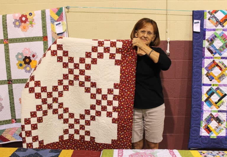 Carol Hall of Owensboro was the lucky winner of the “Bright and Beautiful” quilt.
