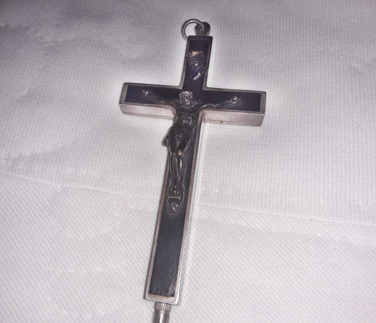 Sister Angela Fitzpatrick shared this cross from her reception as a novice: “I received the relic cross for my reception as a novice in January 1966 from Sister Dorothy, OSU. One of the relics inside it is of Saint Dorothy. My baptismal name was Dorothy, but Mother Charles gave me the name Sister Angela Marie at my reception. I am honored to have been given that name. I keep the crucifix on the pillow on my bed.”