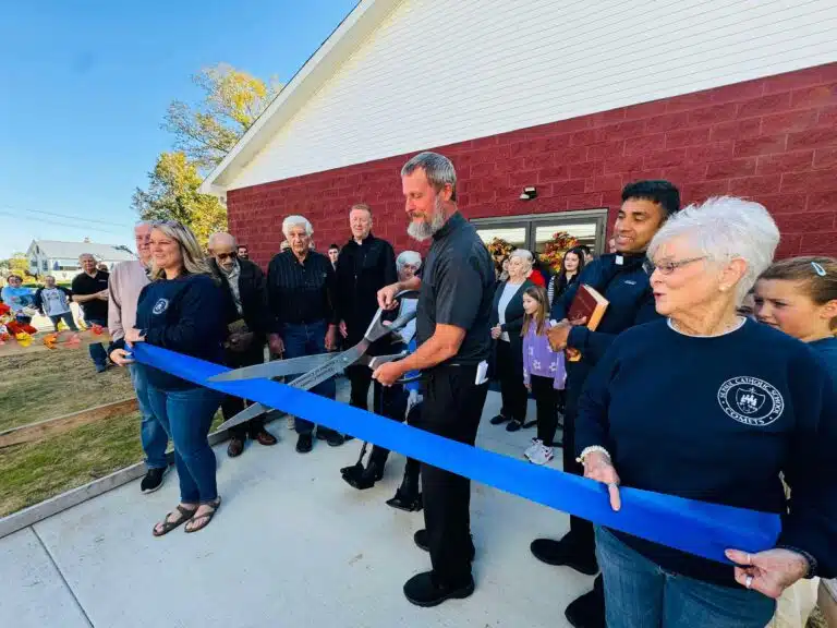 Father Steve Hohman, the former pastor of St. Paul who led the fund-raising effort for the annex, uses the Grayson County Chamber of Commerce scissors to cut the ribbon on the annex. Father Hohman is now pastor at Christ the King in Madisonville. Father Steve Hohman, the former pastor of St. Paul who led the fund-raising effort for the annex, uses the Grayson County Chamber of Commerce scissors to cut the ribbon on the annex. Father Hohman is now pastor at Christ the King in Madisonville.