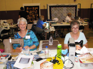 Ruth Donnell, left, and Betty Brooks, both of Lebanon, Tenn., enjoy their time at the Sit and Sew on Sept. 17 in the Mount gymnasium.
