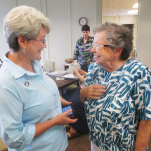 Ursuline Sister Pam Mueller, left, talks with Sister Betty Finn, a Sister of Charity of Cincinnati, who was the facilitator for the community’s Chapter of Affairs.
