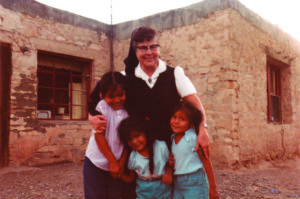 Sister Marie Brenda poses with the daughters of Edwin and Jane Leon outside their home at the San Estevan Indian Mission in Acoma, N.M., in the mid-1980s.