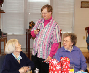 Sister Mary Elizabeth Krampe, left, and Sister Marie Michael Hayden, right, talk with Sister Rebecca White as they enjoy some treats.