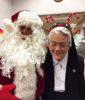 Sister Joseph Angela Boone proudly wore the candy cane antlers to see Santa.