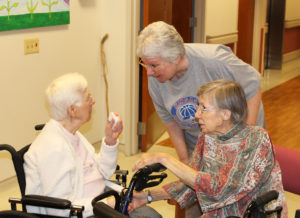 Sister Pat Lynch, center, listens to Sister Marie Julie Fecher, left, and Sister Amanda Rose Mahoney during the party.